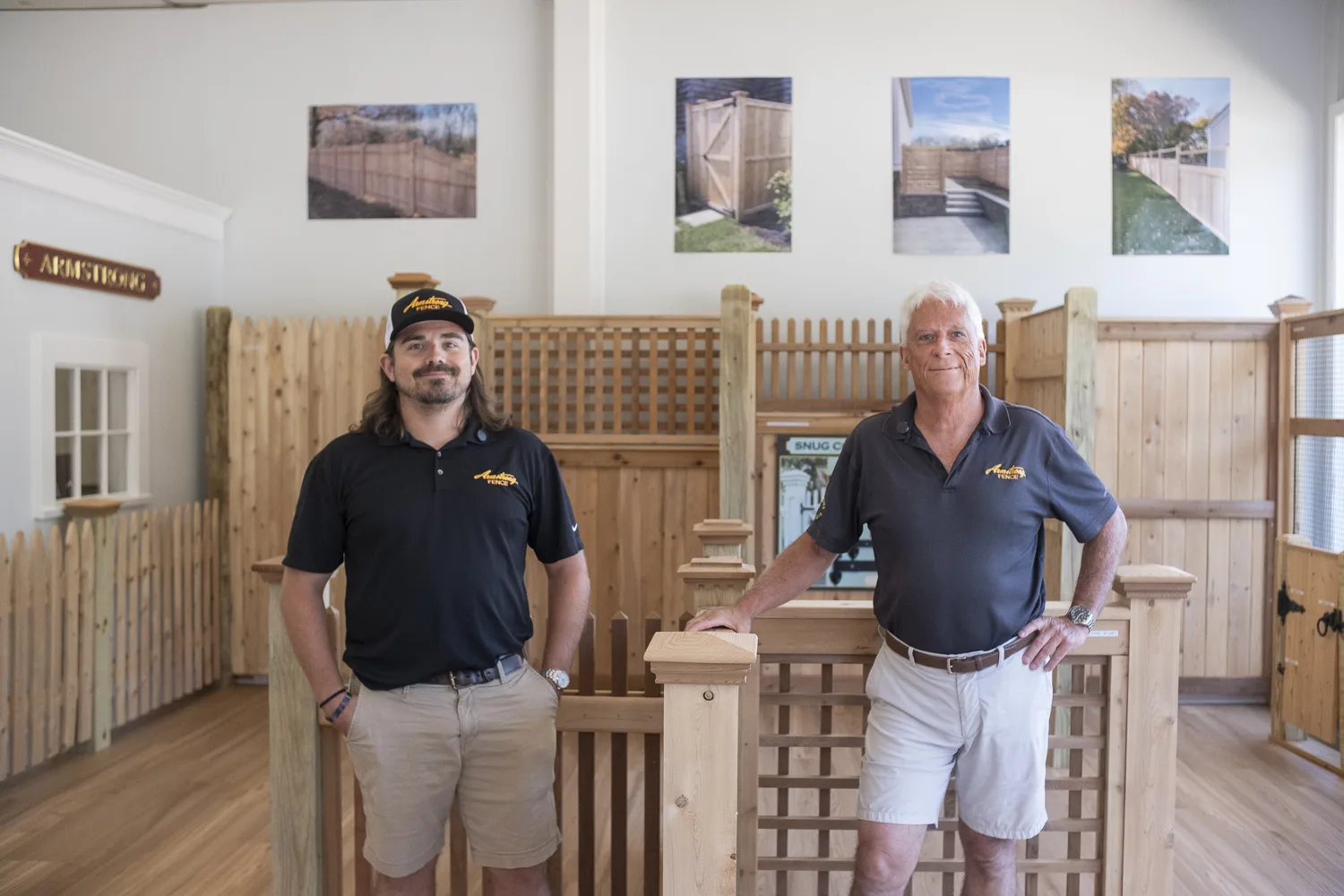 David Armstrong and his son in the cedar fence showroom
