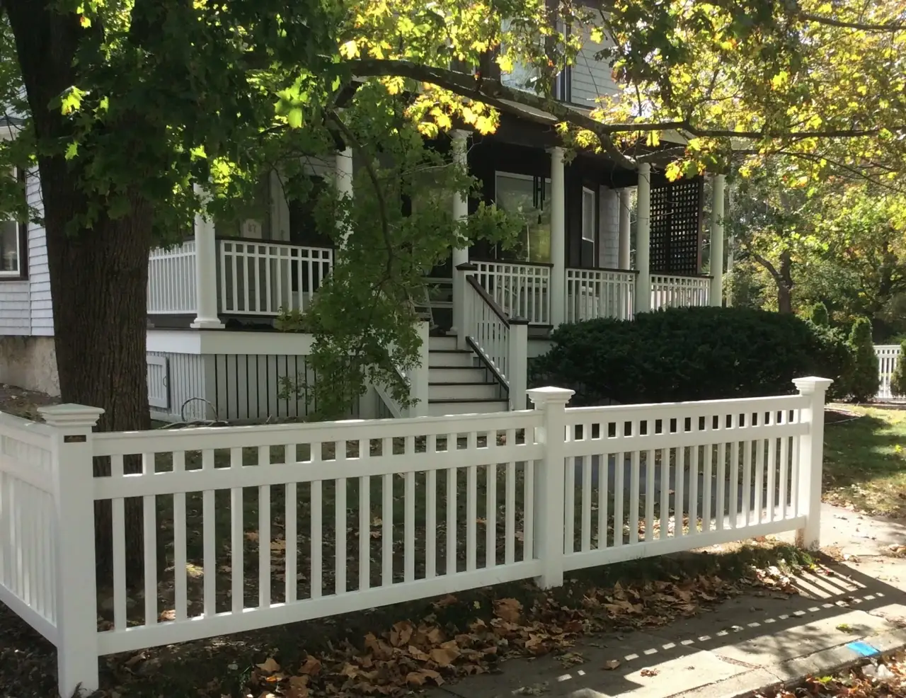 White vinyl privacy fence installed on a South Shore property